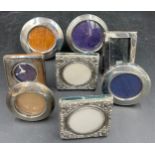 Eight small square and circular silver photograph frames, various dated and makers, largest 8cm d.