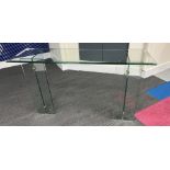 A good quality glass side table 73 h x 132 w x 38cm d.
