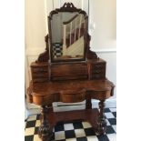 A Victorian figured walnut dressing table with frieze drawers, swivel mirror, seven drawers to top