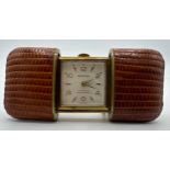 Hermes 15 jewels Antimagnetic leather bound travel clock. US PAT 2640668. US PAT 2719402.