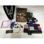 A selection of costume jewellery to include necklaces, earrings, brooches etc along with a
