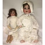 A Heubach Koppelsdorf doll, Model No 300, with sleeping blue eyes approx. 56cm together with a