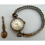 A nine carat gold cased Vertex ladies wristwatch on gold pated expanding bracelet together with a