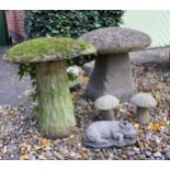 A collection of reconstituted stone mushrooms and piglet, tallest mushroom 41cm.