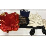 Vingate clothing to include two dresses one red with frilled decoration and yellow binding,