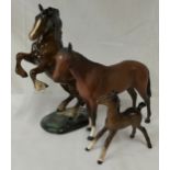 Collection of three horses one rearing horse by Beswick, a foal by Beswick and a Royal Doulton