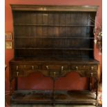 A part late 18thC oak dresser, 6 drawers to base and shelved back. 179 w x 40 d x 204cm h.