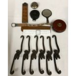 A collection of miscellaneous items to include a Sterling silver hand mirror, 6x metal monkeys