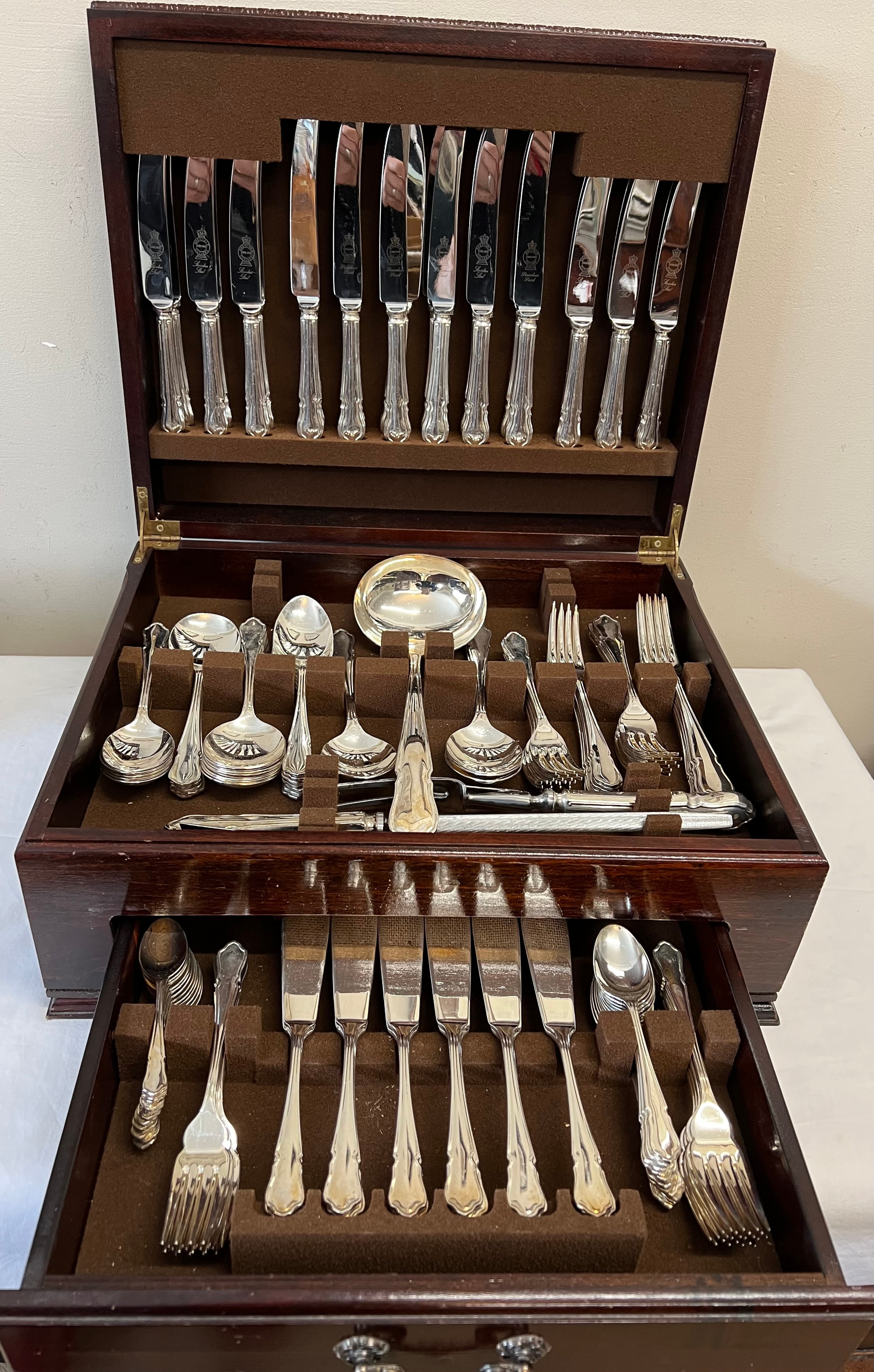 A a wooden cased canteen of silver plated cutlery with drawer to front.