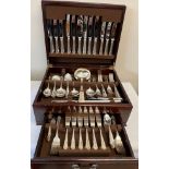 A a wooden cased canteen of silver plated cutlery with drawer to front.