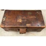 A good quality early 20thC Vintage solid leather travel trunk, stamped John Pound & Co of London.