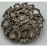 A late 19th/early 20th century circular brooch set with old cut diamonds. Total weight 6.9g. 2.5cm
