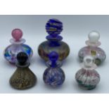 Five Isle of Wight perfume bottles with stoppers together with another unlabelled possibly Isle of