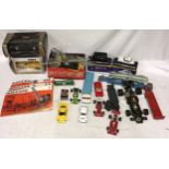 A collection of toys to include cars and Meccano. Meccano to include three instruction manuals parts