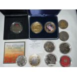 A collection of 9 five pound coins to include Lest We Forget, Elizabeth II Coronation, Winston