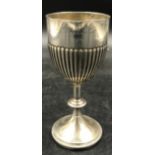 A silver continental goblet marked 800. 84.7 gms along with a commemorative football coin marked