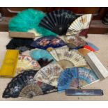 A collection of various fans to include wood, bone, plastic, paper, silk, feathers etc.