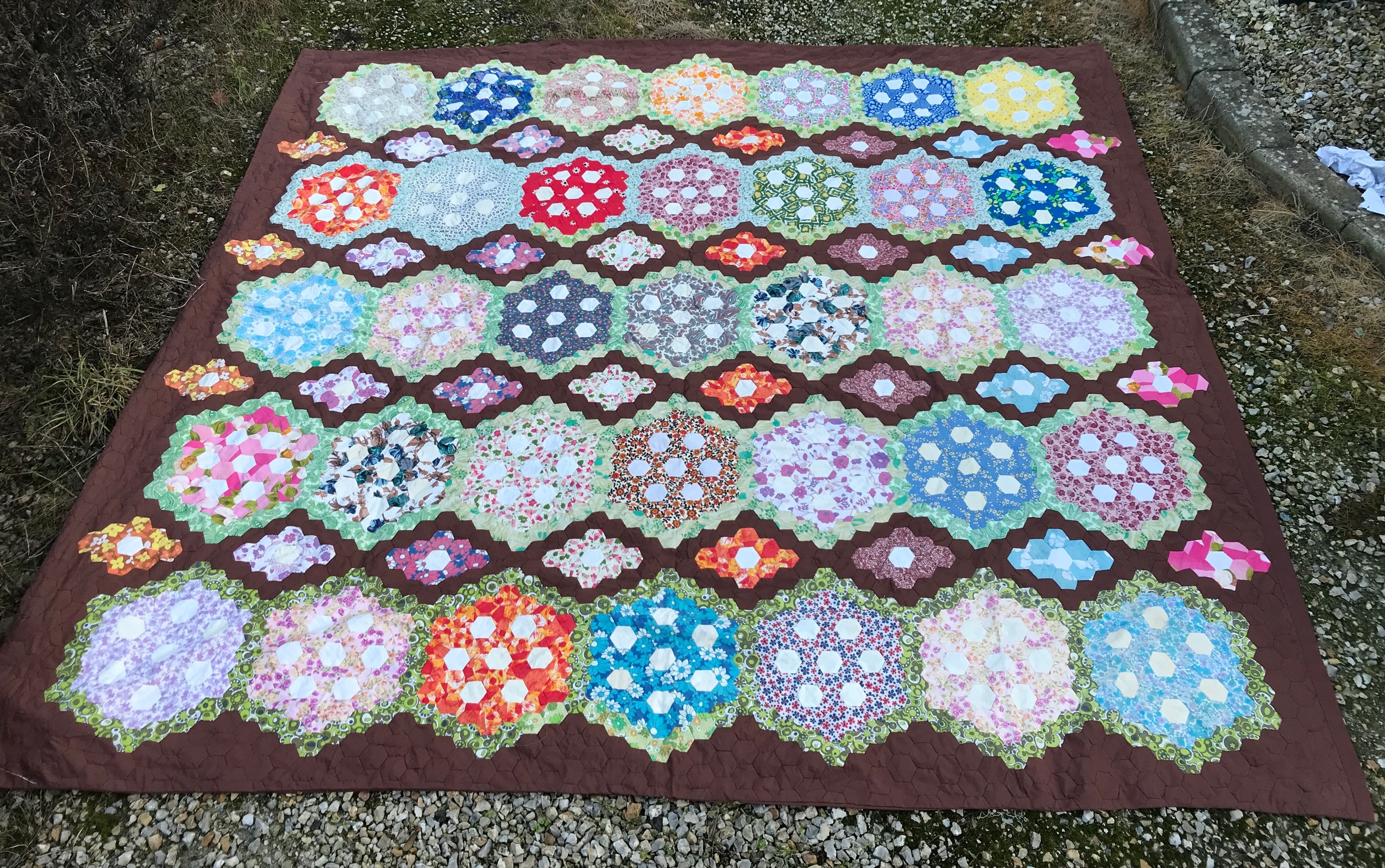 Hand sewn patchwork quilt cover 240cm x 225cm brown backing with octagonal shapes to the front.