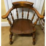 A 19thC oak Captain's chair. 76 h x 71cm at widest.
