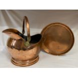Copper tray and hammered copper coal helmet. Helmet 27cm h. Tray measuring 36cm d.