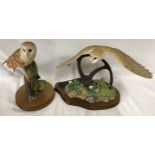 Pair of Border Fine Arts Owls one flying and one perched on a piece of wood. Largest 26 x 40cm.
