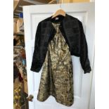 Gold brocade dress size 14S by Rembrandt with button and bow decoration to the back along with a