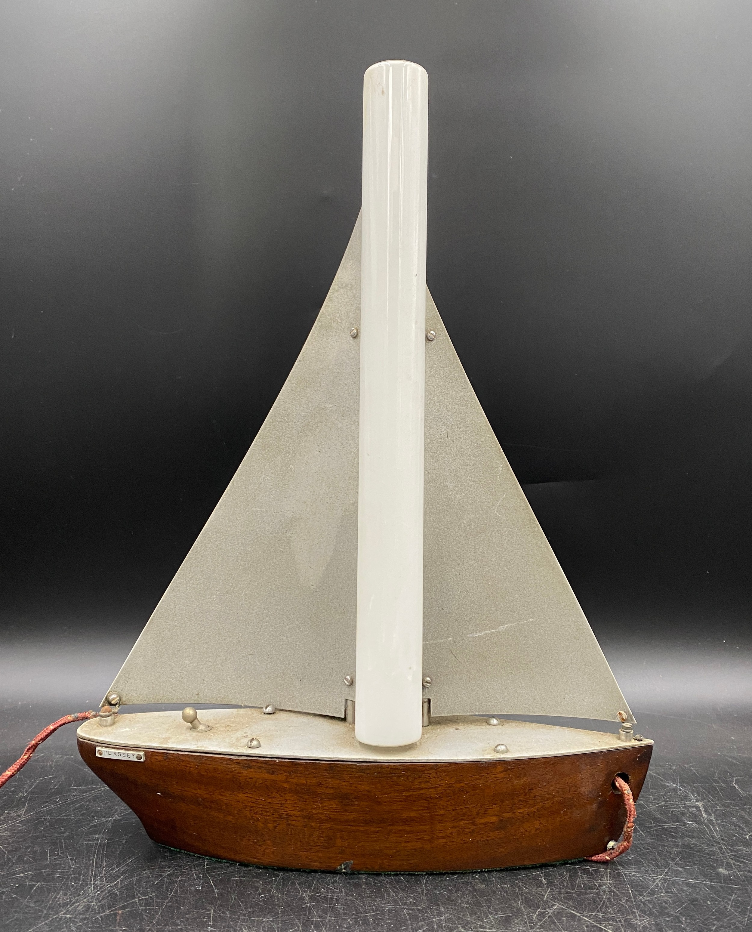 A mid-century chrome and hardwood lamp modelled as a sailing boat 'Plassey', height 36cm to top of