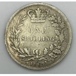An 1864 Queen Victoria silver shilling, die no 13.