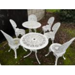Two metal garden tables and 6 chairs. Tables 69cm d.
