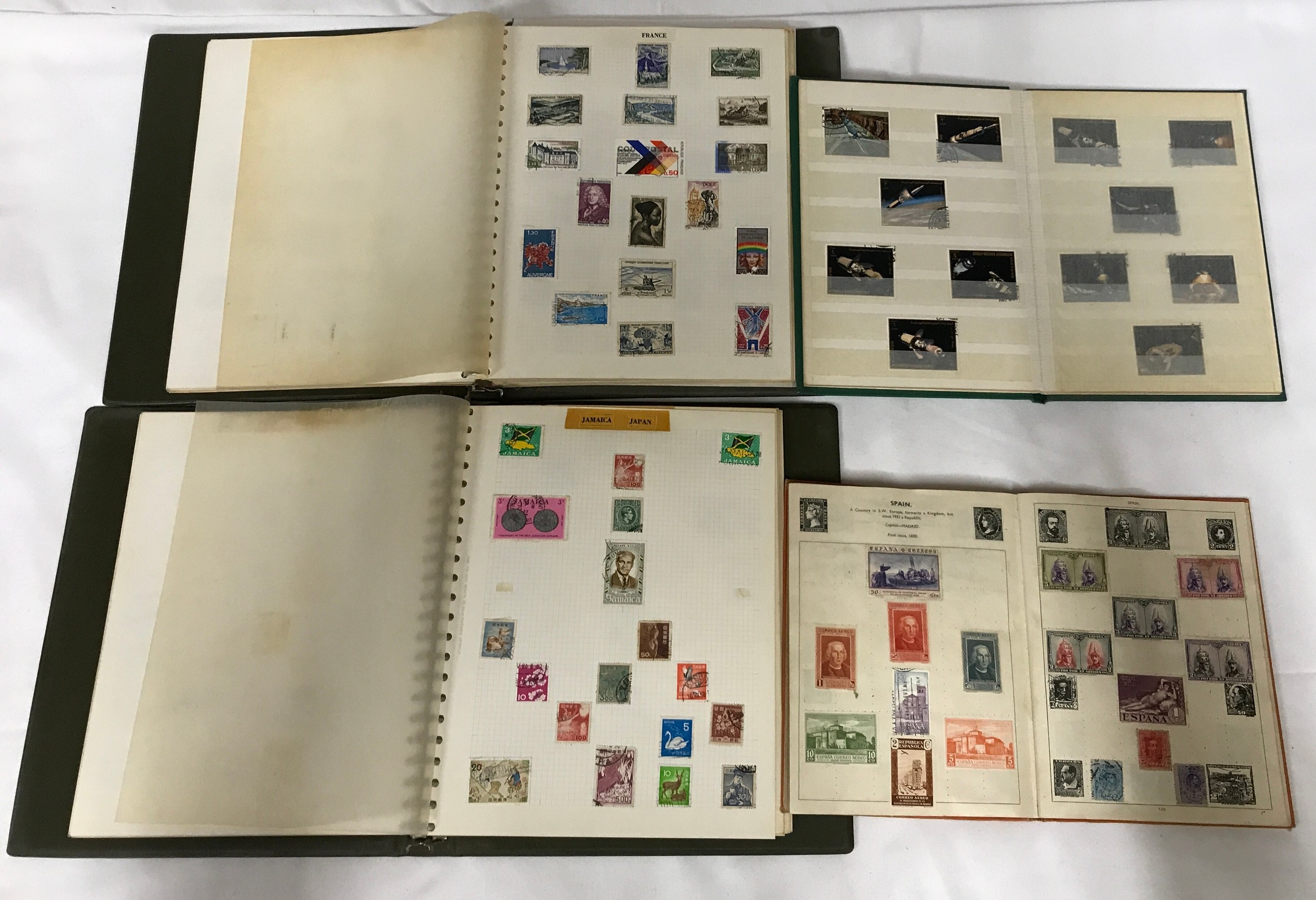 A collection of world stamps in 4 full albums.