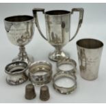Silver to include cups, napkin rings, thimbles and a continental cup marked 835. Various dates and