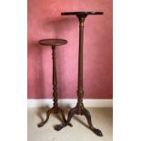 Two mahogany torchere on tripod bases, one with ball and claw feet and one with shell inlay to