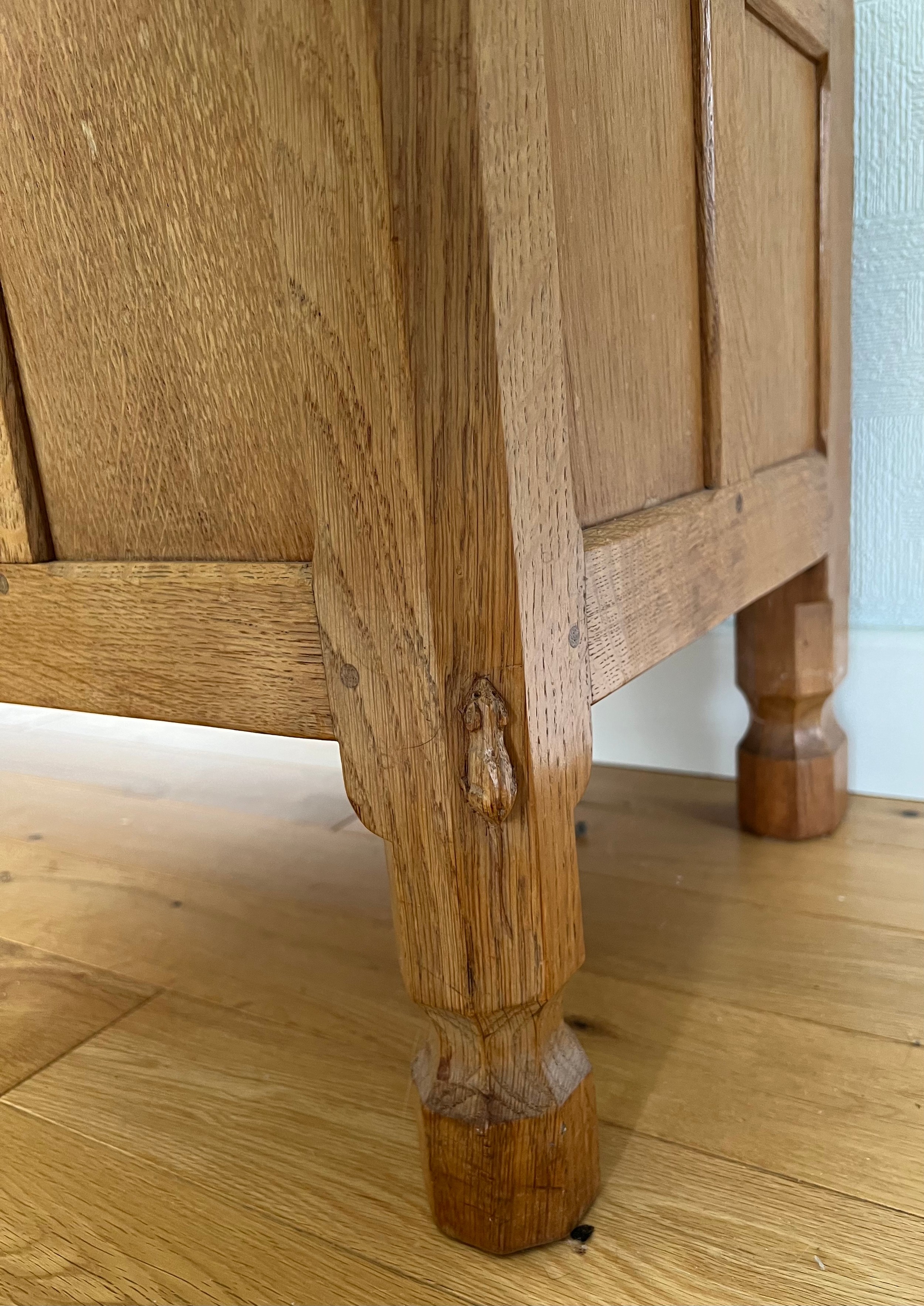 A Robert Mouseman Thompson panelled oak blanket box with hinged top on short octagonal baluster - Image 3 of 8