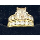 Two diamond set rings to include a radiant cut diamond 2.45 carat S12 I1 approximately with diamonds
