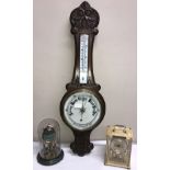 An oak aneroid barometer with thermometer. 84 h x 26cm w together with a gilt and green Kundo