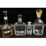 Four decanters, largest, 27 x 12cm diameter, smallest 14.5 with "Repton School" engraved on the