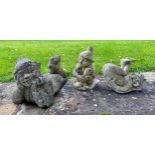 Three garden ornaments of pixies with crossed legs. Recumbent pixie 50 l x 29cm h.