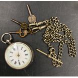 A continental silver pocket watch marked .935 along with a white metal chain with three keys