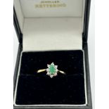 Emerald and diamond ring set in 9 carat gold. Size M. Weight 1.5gm.