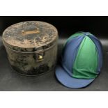 A Charles and Owen young riders jockey hat along with a Metal military hat box