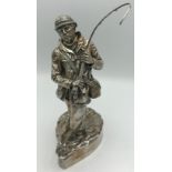 A silver figure of a fisherman Sheffield 1987 maker HL. Marked 'filled' to base and signed R.