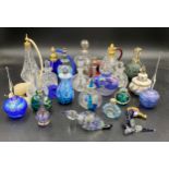 A large collection of various glass perfume bottles to include one labelled Gozo, Waterford