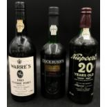 Three bottles of Port to include Warre's 1983 vintage port, Cockburn's Special Reserve Port and