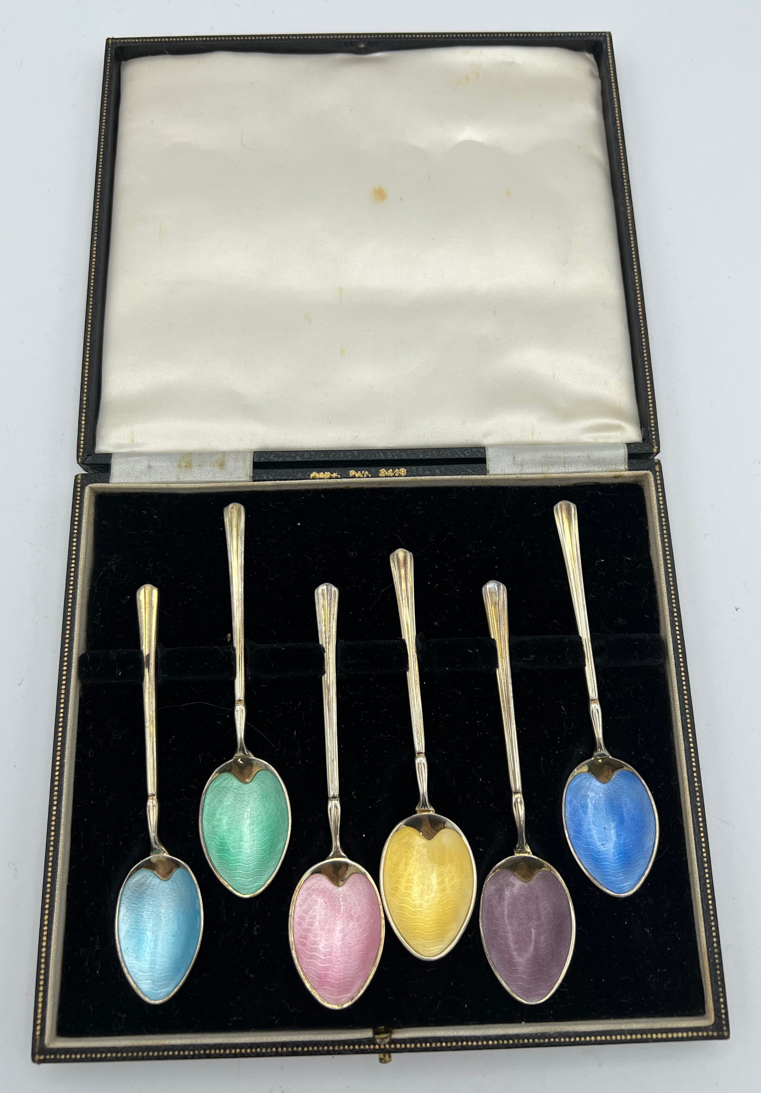 Boxed silver and enamel teaspoons. Birmingham, one 1956, maker T&S.