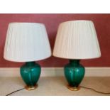 A pair of green glass and gilt table lamps. 35.5cm h to top of fitting.