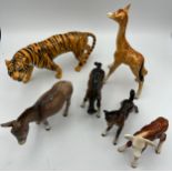 Six various Beswick animals to include Tiger, Donkey, Giraffe and others.