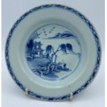 A Chinese blue and white shallow dish 16.5cm diameter x 3cm depth. Probably Qian Long. Crack to rim.