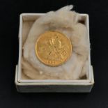 A 1908 1/2 Sovereign coin.