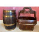 A wooden brass coppered barrel with swing handle together with a rustic wooden container with