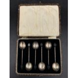 A cased set of six silver bean handle coffee spoons, by William Suckling, Birmingham 1927, total